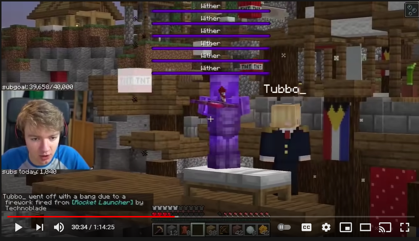 A screenshot from Tommy's stream. He's in L'manberg during the chaos of doomsday. TNT rains from above. There are wither health bars covering half of the screen. Technoblade points a fireworks launcher directly at Tommy. Tubbo is at Techno's side, having just respawned from Techno killing him with the same launcher (noncanonically).